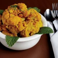 Aloo Gobi · Fresh cut cauliflower and potatoes cooked with herbs and spices.