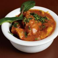 Chicken Curry · Boneless chicken cooked in onions, garlic, ginger, yogurt, spices.