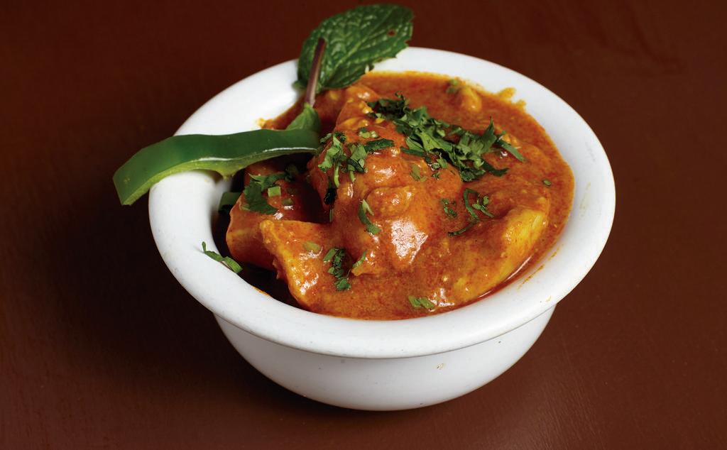 Chicken Curry · Boneless chicken cooked in onions, garlic, ginger, yogurt, spices.