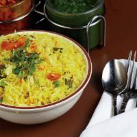 Vegetarian Biryani · Basmati rice cooked with green vegetables, garnished with dried fruits.