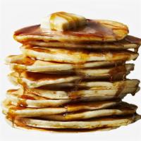 Classic Pancakes · Two large pancakes served with syrup.