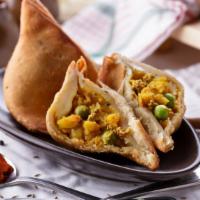 Vegetarian Samosa · Authentic Indian pastry filled with savory, spiced potatoes.