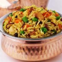 Vegetable Biryani · Saffron basmati rice and mixed vegetables cooked with exotic spices and a touch of cilantro,...