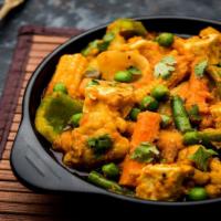 Mixed Vegetable Curry · Fresh mixed vegetable sautéed with curry leaf, mustard seed spices, and coconut milk.
