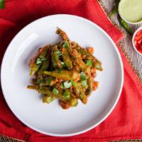Okra Masala · Okra (lady fingers) cooked with onions, stewed tomatoes and various spices, garnished with g...