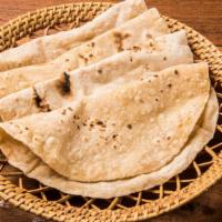 Tandoori Roti · Whole wheat thinly rolled flat bread.