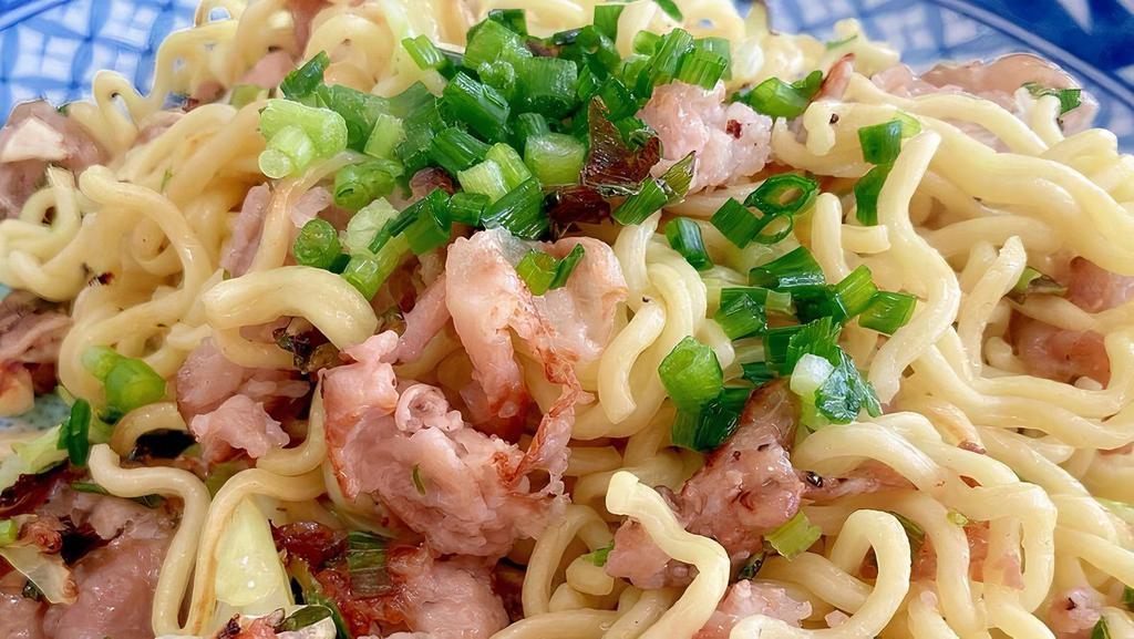 Garlic Pork Yakisoba · Yakisoba is a classic Japanese stir-fried noodle dish with Pork and green onion  with beansporuts that’s seasoned with garlic sauce on top of fried eggs