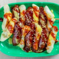 So-Ttteok (소떡소떡) · Fried sausage and rice cake skewer. Topped off with our special  sweet & spicy sauce and mus...