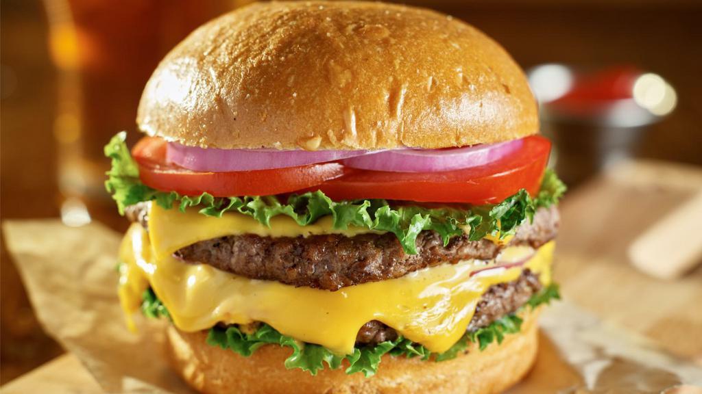 Cheeseburger · Ground angus beef and creamy cheese with your choice of toppings between soft burger buns and crispy fries.