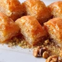 Walnut Baklava · Tender walnuts nestled in layers of buttery flaky filo dough made with honey.