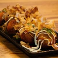 Takoyaki (6) · Fried dumplings, octopus, bonito flakes, mayo, seaweed.