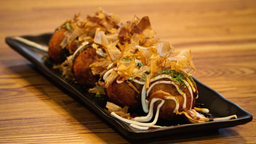 Takoyaki (6) · Fried dumplings, octopus, bonito flakes, mayo, seaweed.