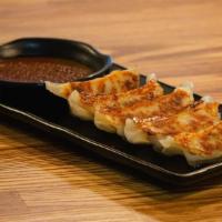 Gyoza (5) · Pan fried pork dumplings, mustard, yuzu vin.