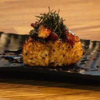 Onigiri Unagi · Rice ball, unagi, seaweed, roasted sesame seeds.