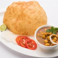 Chole Bhature · Combination of chana masala (spicy chickpeas) and fried bread (bhatura).