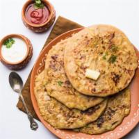 Aloo Paratha · Whole wheat bread stuffed with peas and potatoes.