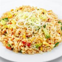 Fried Veggie Rice · Rice loaded with tender vegetables, tofu and soy sauce.