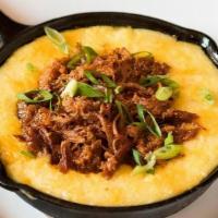 BBQ Pulled Pork Bowl · Slow-roasted BBQ pulled pork over your choice of stone-ground grits w/ tomato sofrito or mas...