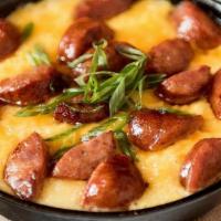 Andouille Sausage Bowl · Andouille Sausage over your choice of stone-ground grits w/ tomato sofrito or mashed potatoe...