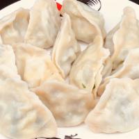 Pork & Cabbage Dumplings (10 Pieces) · Boiled. Dumplings filled with mixture of seasoned ginger and garlic infused ground pork and ...