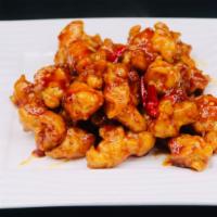 Szechuan Chicken · Batter and fried chicken diced with onion roasted red peppers and a special spicy garlic sau...