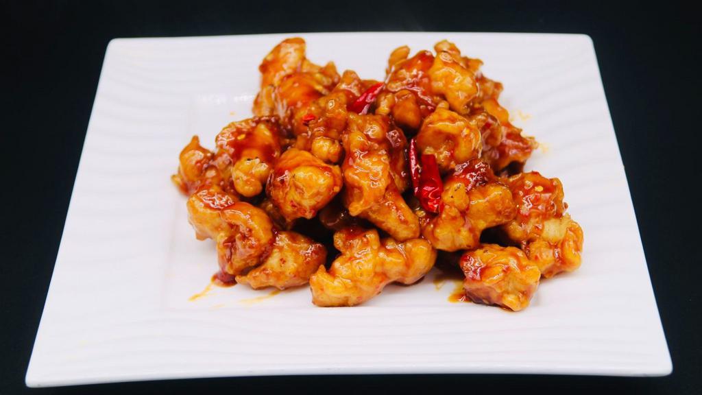 Szechuan Chicken · Batter and fried chicken diced with onion roasted red peppers and a special spicy garlic sauce.