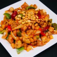 Kung Pao Chicken · Diced chicken stir fried with zucchini, bell peppers, onions, celery, water chestnuts in spi...