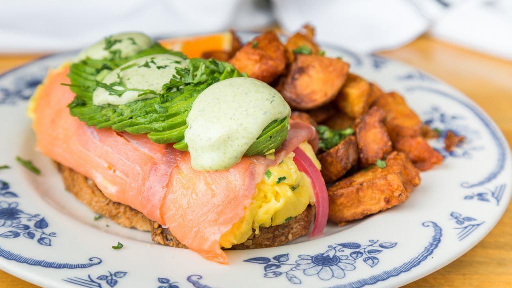 Salmon Rotolone Tartine · Smoked salmon, neufchatel + chive scrambled eggs, avocado, lemon dill sauce, pickled red onion, aioli, and grilled miche.
