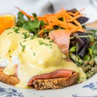 Norwegian Benedict · Smoked salmon, garlic sauteed spinach, caper, chive hollandaise, and grilled miche.