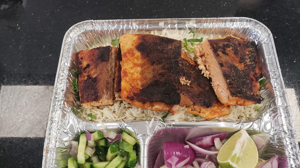 Mahi Kabob platter(Salmon) · Tandoori salmon served with rice roasted tomato & salad