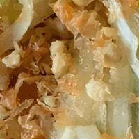 Papaya Salad · Green papaya salad with dried shrimp, tomatoes, carrots, green beans, lime, peanuts, and tam...