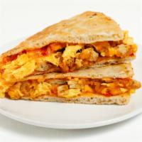 Southern 'Zone · Enjoy a fluffy pizza dough with whipped eggs, bacon, chicken tenders, cheddar and pimento ch...