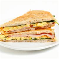 Ham 'Zone · Indulge in whipped eggs, sliced ham, baby spinach, and Swiss cheese folded into a pizza doug...