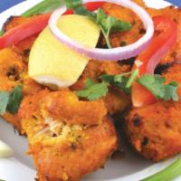 Fish Pakora · Fried fish cubes with garbanzo beans.