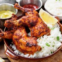 Chicken Tandoori with Rice · Delicious marinated 2 chicken legs cooked in clay.