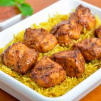 Chicken Boti with Rice · Delicious marinated chicken cubes cooked in clay.