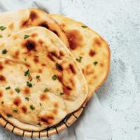 Naan · Fresh bread baked in clay oven.