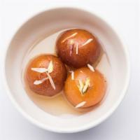 Gulab Jamun · Caramelized milk balls in syrup.