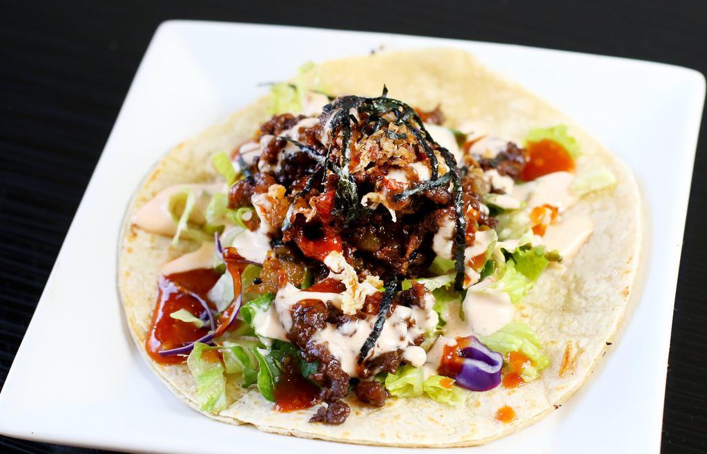 Zen Taco · Soy and Portobello mushroom patty, sesame vinaigrette lettuce, red sauce, Japanese mayo, fried onions, nori.