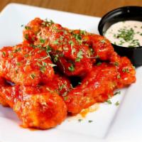 Korean Buffalo Wings · Spicy level one. Korean fusion buffalo sauce, red pepper parsley, side of Japanese mayo.