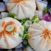 Pan Seared Black Pepper Beef Bao (3) · These baos are filled with beef.  After they are steamed, they are seared with a touch of bu...