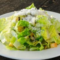 Romaine · Parm, fried capers, herbed croutons, and lemon anchovy or champagne-dijon vinaigrette. Serve...
