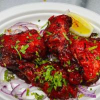 Tandoori Chicken Legs · 2 pieces. Fresh chicken legs marinated with yogurt, ginger-garlic, and Indian spices, roaste...