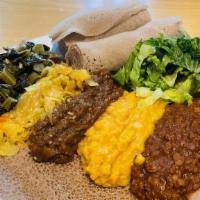 Ethiopian Foods Injerra with Veggies · This dish  is traditional very spicy. it comes with 100% veggie and also your choice of meat...