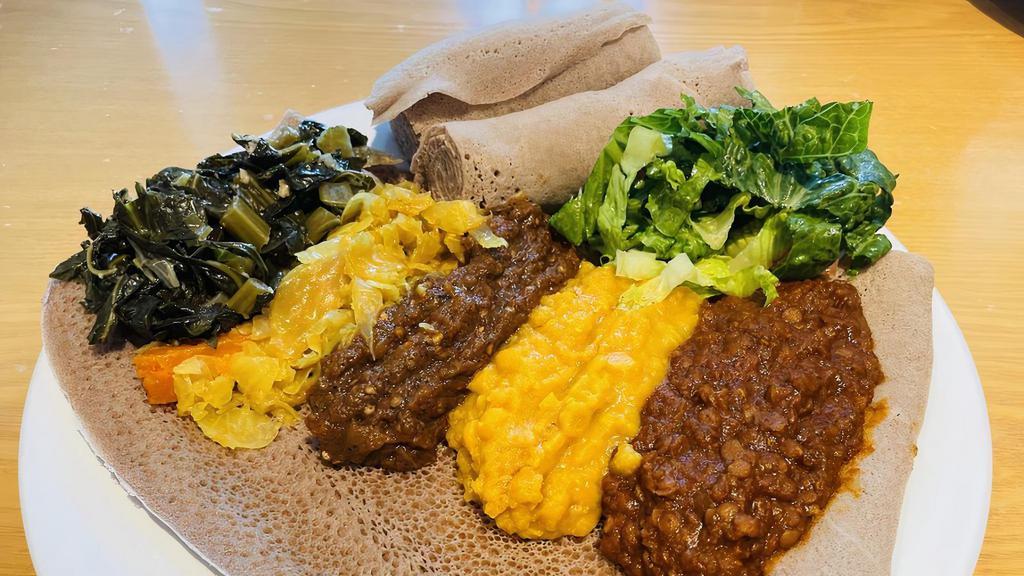 Ethiopian Foods Injerra with Veggies · This dish  is traditional very spicy. it comes with 100% veggie and also your choice of meats. we use soft Ethiopian bread that its call injera'. you can Chicken beef or lamb.

Option: we also use Lahooh similar to injera but very low sadium and very tasty use by Somalian.