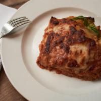 Lasagna Al Ragu · Homemade besciamella cream, angus beef ragu sauce, and parmigiano reggiano cheese.