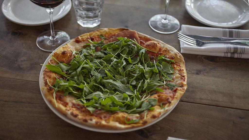 Pizza Prosciutto E Rucola · Tomato sauce, mozzarella, prosciutto di Parma, and arugula.