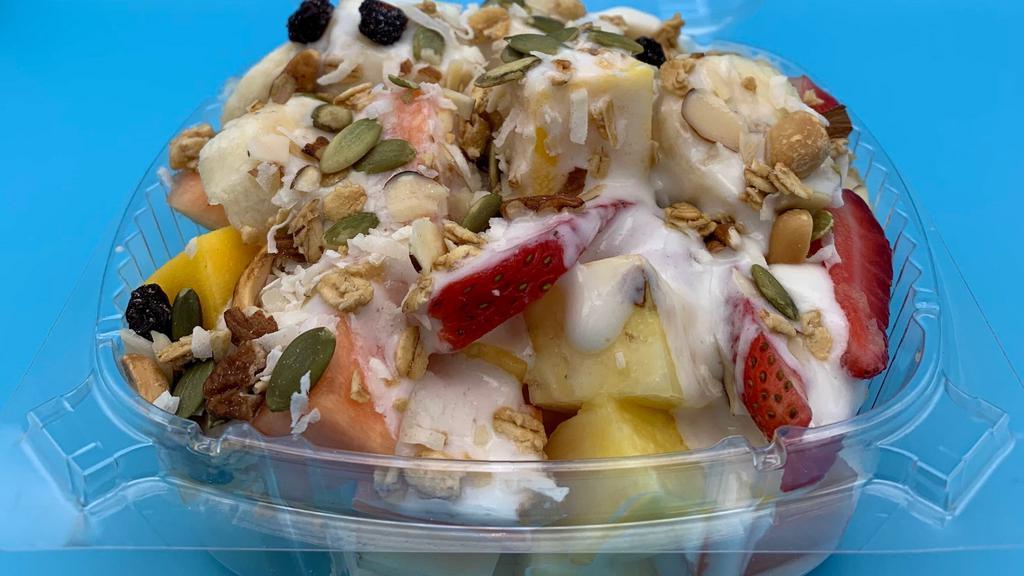 Bionico · Our take on granola and fruit will delight you. Melon, pineapple, apple, banana, and strawberries over granola, smothered with sweet cream, coconut shaves, pecans and raisins.