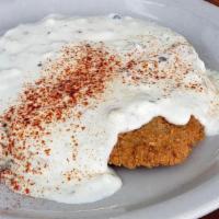 Country Fried Steak & Eggs* · Served with three eggs any style and country gravy and baked biscuit or toast