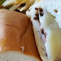 French Dip* · Thinly Sliced Sirloin, topped with melted Jack Cheese on grilled French Roll. Served with Au...